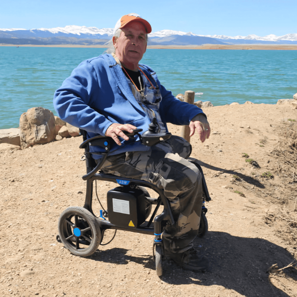Man seated confidently in an electric wheelchair